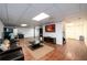 View of finished basement with wood-look floors, recessed lights, TV, and comfortable seating area at 1435 Jay Ct, Snellville, GA 30078