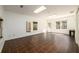 Expansive bonus room has a tile floor, windows, and two exterior door exits for flexible, well-lit space at 1435 Jay Ct, Snellville, GA 30078