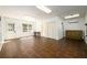 Bright bonus room features tile floors, neutral paint, with natural light from the door, windows, and closet storage at 1435 Jay Ct, Snellville, GA 30078