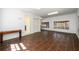 Large bonus room boasts tile floors, neutral paint, ample lighting, and a bathroom connection with doors and windows at 1435 Jay Ct, Snellville, GA 30078