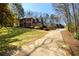 Beautiful two story brick home with mature landscaping, three car garage and long driveway at 1435 Jay Ct, Snellville, GA 30078