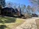Beautiful two story brick home with mature landscaping, three car garage and long driveway at 1435 Jay Ct, Snellville, GA 30078