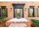 Stylish front entrance with decorative glass door, sidelights, and exterior sconces at 1435 Jay Ct, Snellville, GA 30078