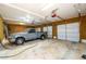 Interior of garage showcasing truck parked alongside three garage doors at 1435 Jay Ct, Snellville, GA 30078