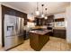 Spacious kitchen featuring stainless steel appliances and a center island with granite countertop at 1435 Jay Ct, Snellville, GA 30078