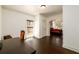 Home office featuring dark wood floors, natural light, and archway to bedroom at 1435 Jay Ct, Snellville, GA 30078