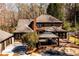 Expansive back yard featuring a deck with gazebo, brick patio and natural surroundings at 1435 Jay Ct, Snellville, GA 30078