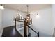 A staircase with dark wooden floors and handrails at 1435 Jay Ct, Snellville, GA 30078