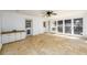 Sunny sunroom featuring tile floors, built-in cabinets, and bright windows at 1435 Jay Ct, Snellville, GA 30078