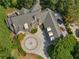 Overhead view of the luxury home with a circular driveway and a three-car garage at 2554 Emerald Dr, Jonesboro, GA 30236