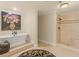 Bathroom with freestanding tub on platform and walk-in shower at 2554 Emerald Dr, Jonesboro, GA 30236