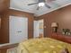 Bedroom featuring a ceiling fan, dresser, and closet at 2554 Emerald Dr, Jonesboro, GA 30236