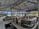 Covered boat dock with multiple slips featuring pontoon boats with views of lake and waterfront homes at 2554 Emerald Dr, Jonesboro, GA 30236