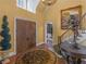 Inviting foyer with hardwood floors, high ceilings, staircase, and decorative statue at 2554 Emerald Dr, Jonesboro, GA 30236