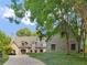 Beautiful stone home with lush landscaping and a long private driveway at 2554 Emerald Dr, Jonesboro, GA 30236
