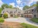 Stunning stone home with a circular driveway and mature landscaping at 2554 Emerald Dr, Jonesboro, GA 30236