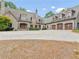 Elegant stone house with a three-car garage and circular driveway at 2554 Emerald Dr, Jonesboro, GA 30236