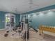 Spacious exercise room with ceiling fans, full gym, and foosball table at 2554 Emerald Dr, Jonesboro, GA 30236