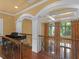 Hallway with wood floors, iron railing, a piano and coffered ceilings at 2554 Emerald Dr, Jonesboro, GA 30236