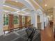 Hallway with wood floors, iron railing, a piano and coffered ceilings at 2554 Emerald Dr, Jonesboro, GA 30236