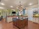 Gourmet kitchen with a large island, custom cabinets, and stainless steel appliances at 2554 Emerald Dr, Jonesboro, GA 30236
