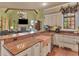 Open-concept kitchen with granite countertops, custom cabinets, and stainless steel appliances at 2554 Emerald Dr, Jonesboro, GA 30236