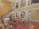 Inviting living room with a staircase, fireplace, and abundant natural light from large windows at 2554 Emerald Dr, Jonesboro, GA 30236