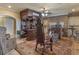 Living area features custom bar, brick fireplace, and luxurious seating at 2554 Emerald Dr, Jonesboro, GA 30236