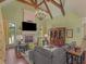 Comfortable living room featuring a vaulted ceiling, fireplace, and built-in cabinets at 2554 Emerald Dr, Jonesboro, GA 30236