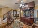 Living area features custom bar, staircase and luxury furniture at 2554 Emerald Dr, Jonesboro, GA 30236