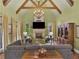 Cozy living room featuring a fireplace, vaulted ceiling, and hardwood floors at 2554 Emerald Dr, Jonesboro, GA 30236