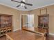 Dual desks, built-in bookshelves, and ceiling fan in the office at 2554 Emerald Dr, Jonesboro, GA 30236