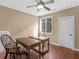 Office space with dual desks, hardwood floors, ceiling fan, and natural light at 2554 Emerald Dr, Jonesboro, GA 30236
