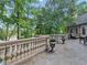 Beautiful outdoor patio features stone floors, manicured planter decor, and decorative railing with views of the lake at 2554 Emerald Dr, Jonesboro, GA 30236
