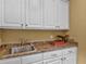 Utility sink with ample cabinet space and laminate countertops at 2554 Emerald Dr, Jonesboro, GA 30236