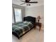 Cozy bedroom boasts ample natural light, complemented by stylish ceiling fan at 109 Thirkield Se Ave, Atlanta, GA 30315
