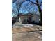 Charming home featuring a welcoming front porch and an expansive concrete driveway at 109 Thirkield Se Ave, Atlanta, GA 30315