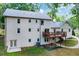 The home's back exterior features a white-bricked wall, a patio, and well-kept landscaping at 2958 Cravey Ne Dr, Atlanta, GA 30345