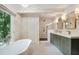 Modern bathroom with a soaking tub, tiled floor, and walk-in shower at 2958 Cravey Ne Dr, Atlanta, GA 30345