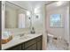 Bright bathroom featuring tiled floors, custom vanity, and sleek fixtures at 2958 Cravey Ne Dr, Atlanta, GA 30345
