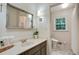 Bathroom featuring a granite vanity top, neutral color scheme, and stylish framed mirror at 2958 Cravey Ne Dr, Atlanta, GA 30345