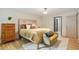 Bedroom featuring stylish furniture, a patterned headboard, and hardwood floors at 2958 Cravey Ne Dr, Atlanta, GA 30345