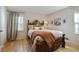 Cozy bedroom with a decorative headboard, plush bedding, and warm natural light at 2958 Cravey Ne Dr, Atlanta, GA 30345