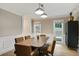 Bright dining room featuring a wood table, modern lighting, and views to the outdoors at 2958 Cravey Ne Dr, Atlanta, GA 30345