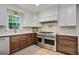 Spacious kitchen with stainless steel appliances, custom cabinets, and quartz countertops at 2958 Cravey Ne Dr, Atlanta, GA 30345
