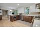 Bright kitchen with stainless steel appliances, granite countertops, an island, and hardwood floors at 2958 Cravey Ne Dr, Atlanta, GA 30345