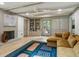 Inviting living room with fireplace, built-in shelving and cabinets, hardwood floors and access to the backyard at 2958 Cravey Ne Dr, Atlanta, GA 30345