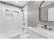 Bathroom with white subway tile shower, marble countertop, and gold fixtures at 4251 Canby Ln, Decatur, GA 30035