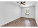 Well-lit bedroom featuring hardwood floors and a ceiling fan at 4251 Canby Ln, Decatur, GA 30035