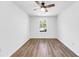 Well-lit bedroom featuring hardwood floors and a ceiling fan at 4251 Canby Ln, Decatur, GA 30035